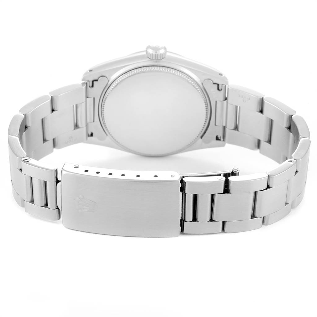 The image shows the back side and clasp of a Mid-Size Rolex watch.