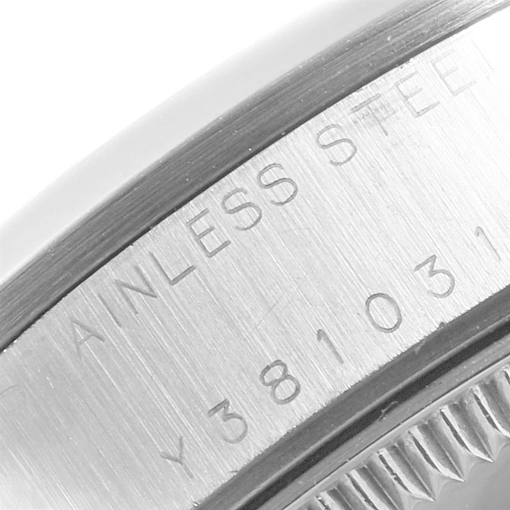 This close-up image shows the side of the stainless steel case of a Mid-Size Rolex watch.