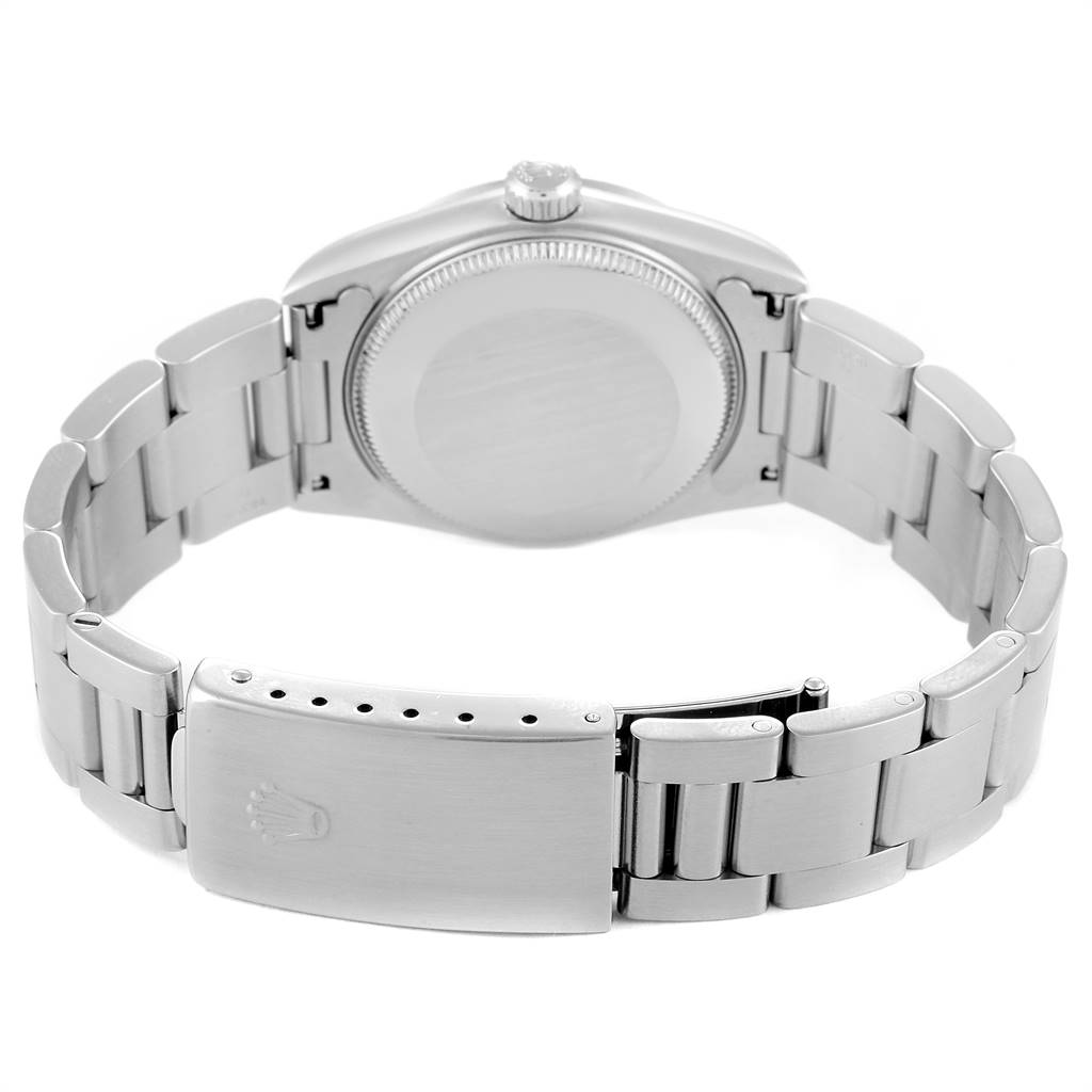 The image shows the rear view of a Rolex Mid-Size 78240 Women's Stainless Steel White Dial 78240 Women's Stainless Steel White Dial model watch, highlighting its bracelet and closed clasp.