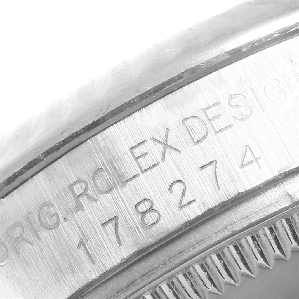 This close-up image of the Mid-Size Rolex watch shows the engraved serial number on the outer edge of the caseback.