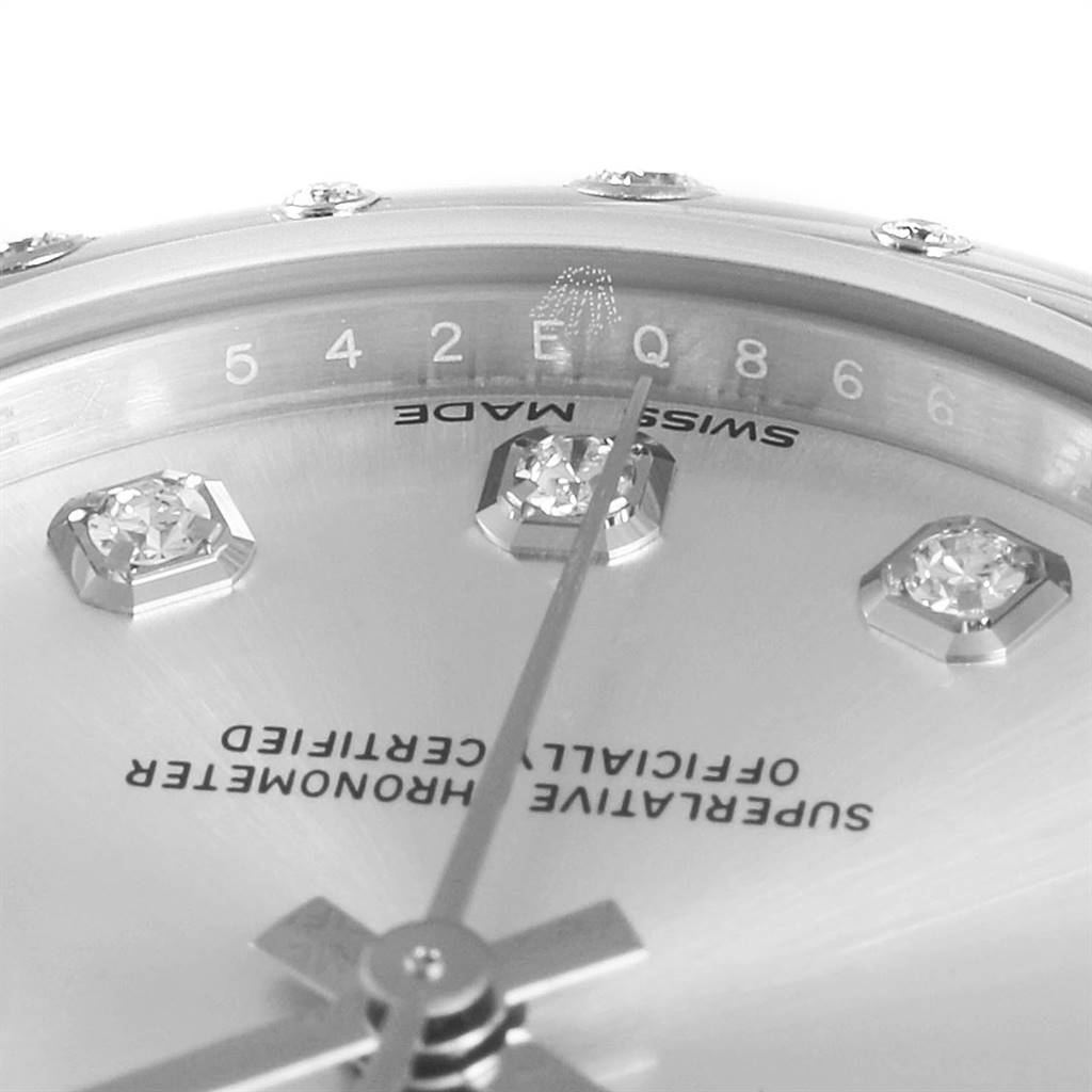 The image shows a close-up of the Rolex Mid-Size 178344 Women's Stainless Steel Silver Dial 178344 Women's Stainless Steel Silver Dial watch face, highlighting diamond indices and the second hand.