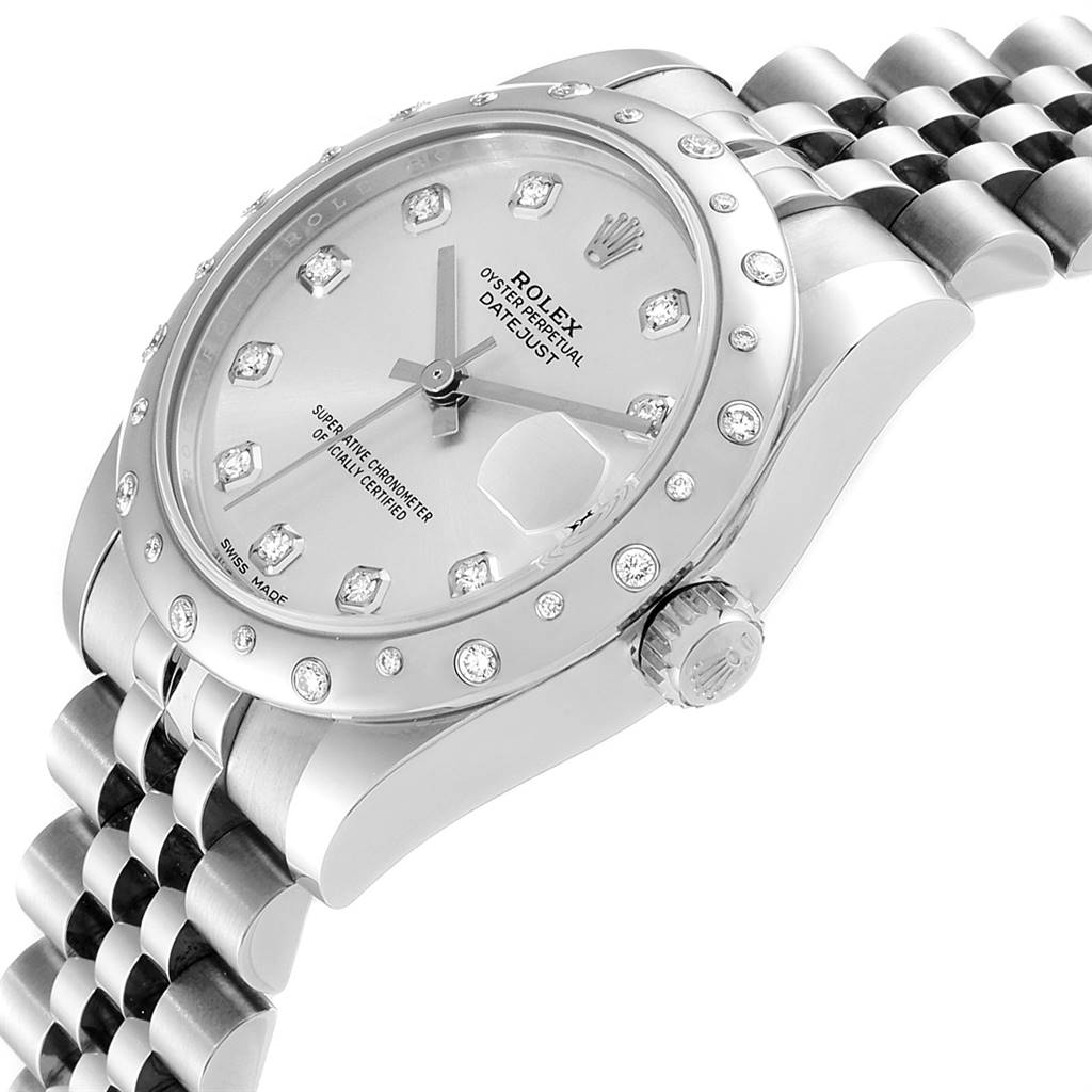 The image shows a partial, angled view of a Mid-Size Rolex watch, highlighting the face, dial, bezel, and part of the bracelet.