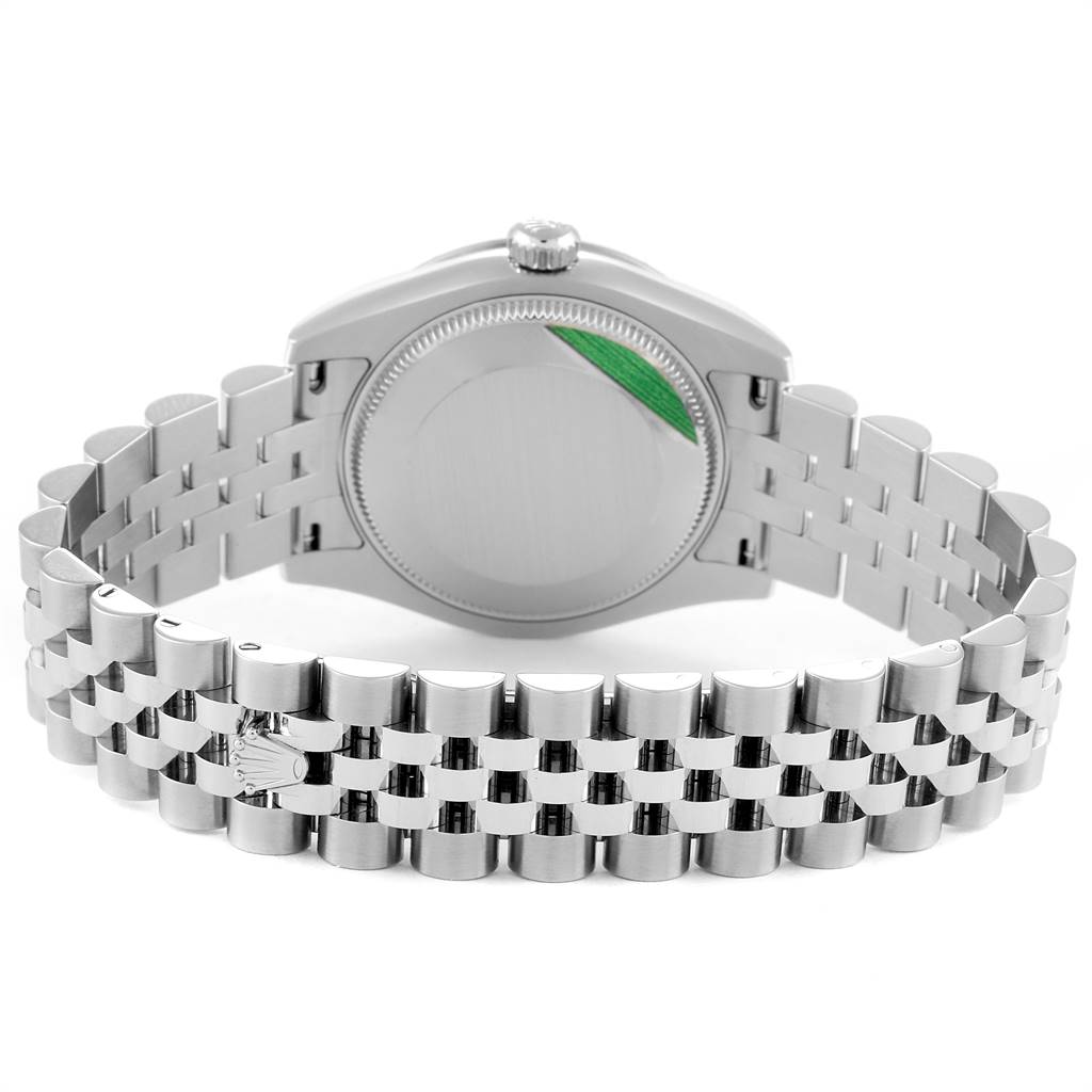 The Mid-Size Rolex watch is shown from the back, highlighting the case back and bracelet.