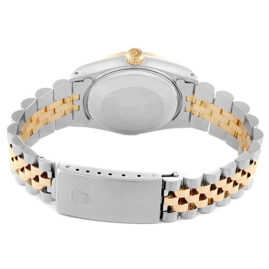 The image shows the back view and bracelet of a Mid-Size Rolex watch, highlighting the case, crown, and two-tone band.