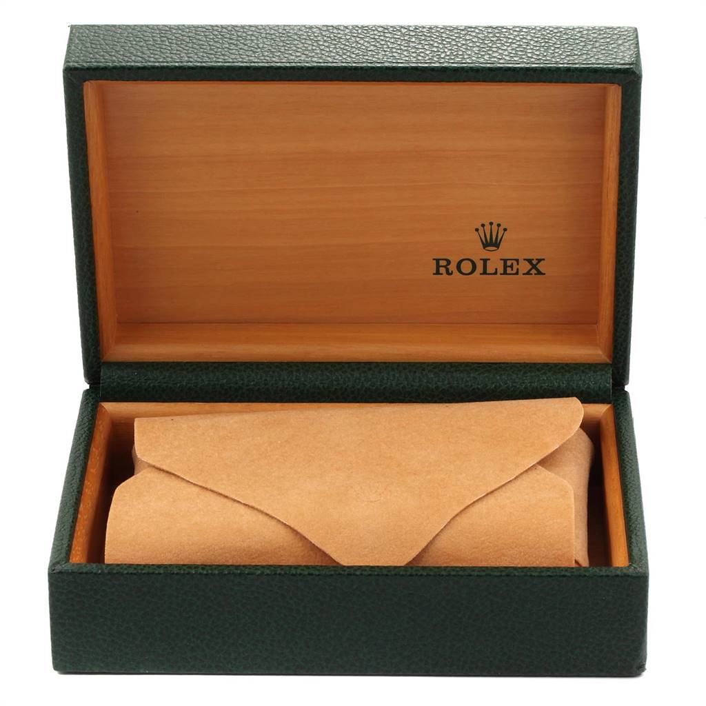 A Rolex Mid-Size 68273 Women's Steel and Gold (two tone) Champagne Dial 68273 Women's Steel and Gold (two tone) Champagne Dial model watch box with a green exterior and beige interior, containing a brown leather pouch.
