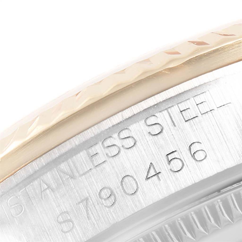 The image shows a close-up of the side of a Rolex Mid-Size 68273 Women's Steel and Gold (two tone) Champagne Dial 68273 Women's Steel and Gold (two tone) Champagne Dial model watch, highlighting the stainless steel case and part of the bezel.