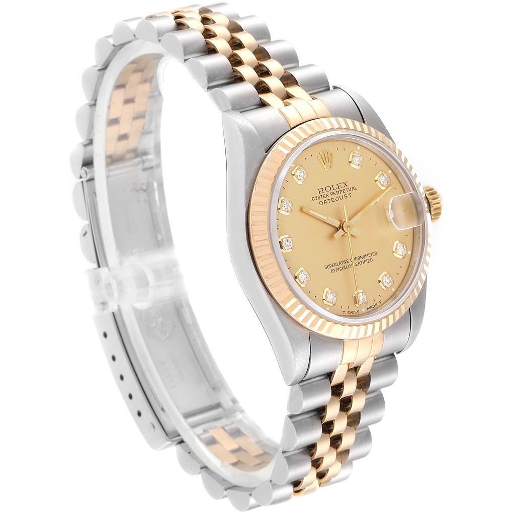 The image shows a side angle of the Rolex Mid-Size 68273 Women's Steel and Gold (two tone) Champagne Dial 68273 Women's Steel and Gold (two tone) Champagne Dial Datejust watch, highlighting its face, bezel, and bracelet.