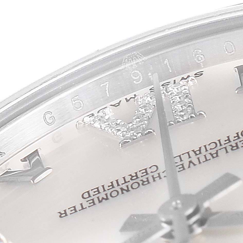 This image shows a close-up of the dial and hour markers of a Mid-Size Rolex watch.