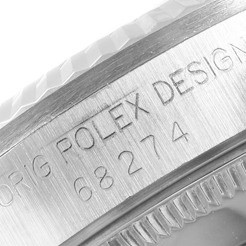 This image shows a close-up of the case engraving on a Mid-Size Rolex watch.