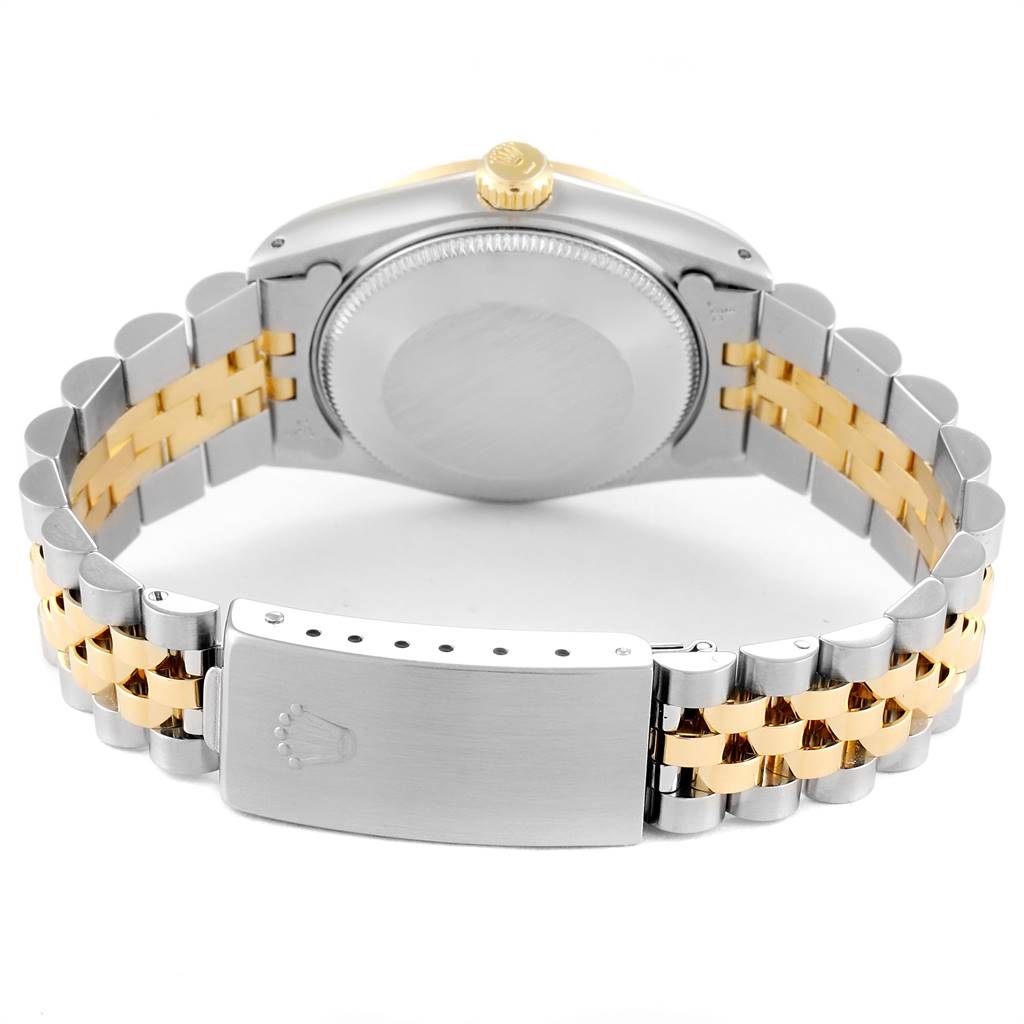 The image shows the backside of a Mid-Size Rolex watch, specifically the case back, crown, and two-tone bracelet with the clasp.
