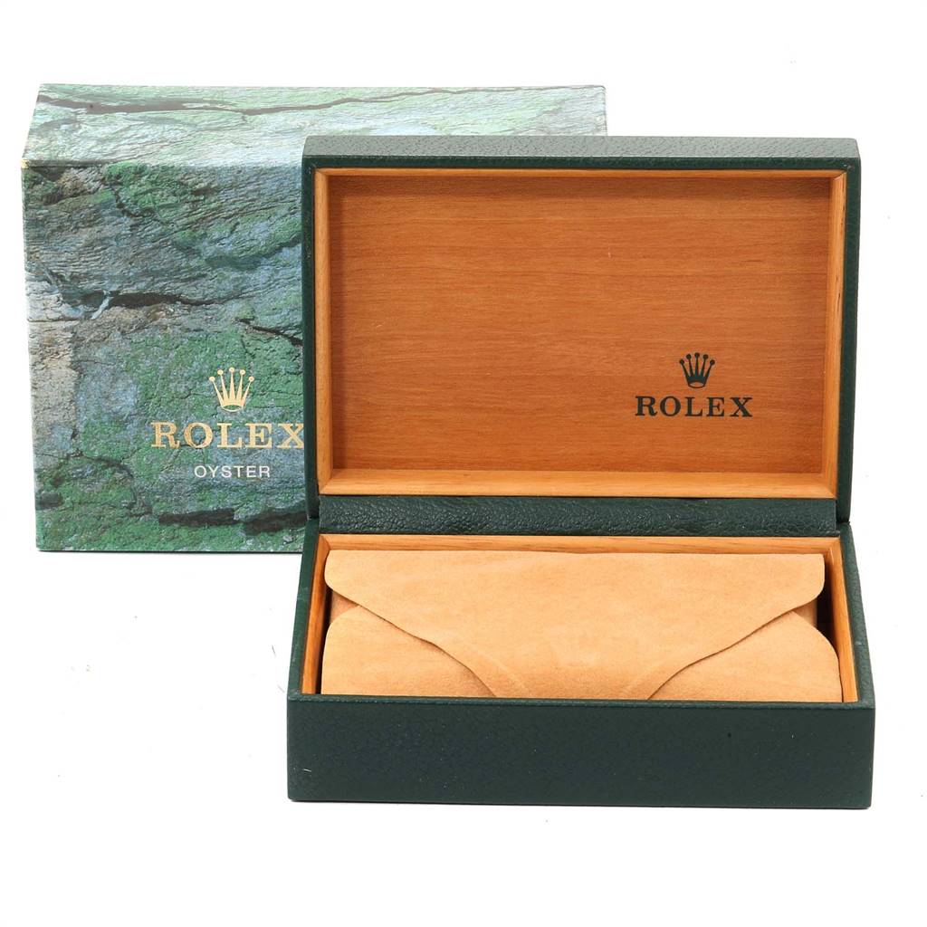 The image shows an open Rolex Mid-Size 68273 Women's Steel and Gold (two tone) Silver Dial 68273 Women's Steel and Gold (two tone) Silver Dial watch box with a green exterior and a tan interior, along with an outer green Rolex branded sleeve.