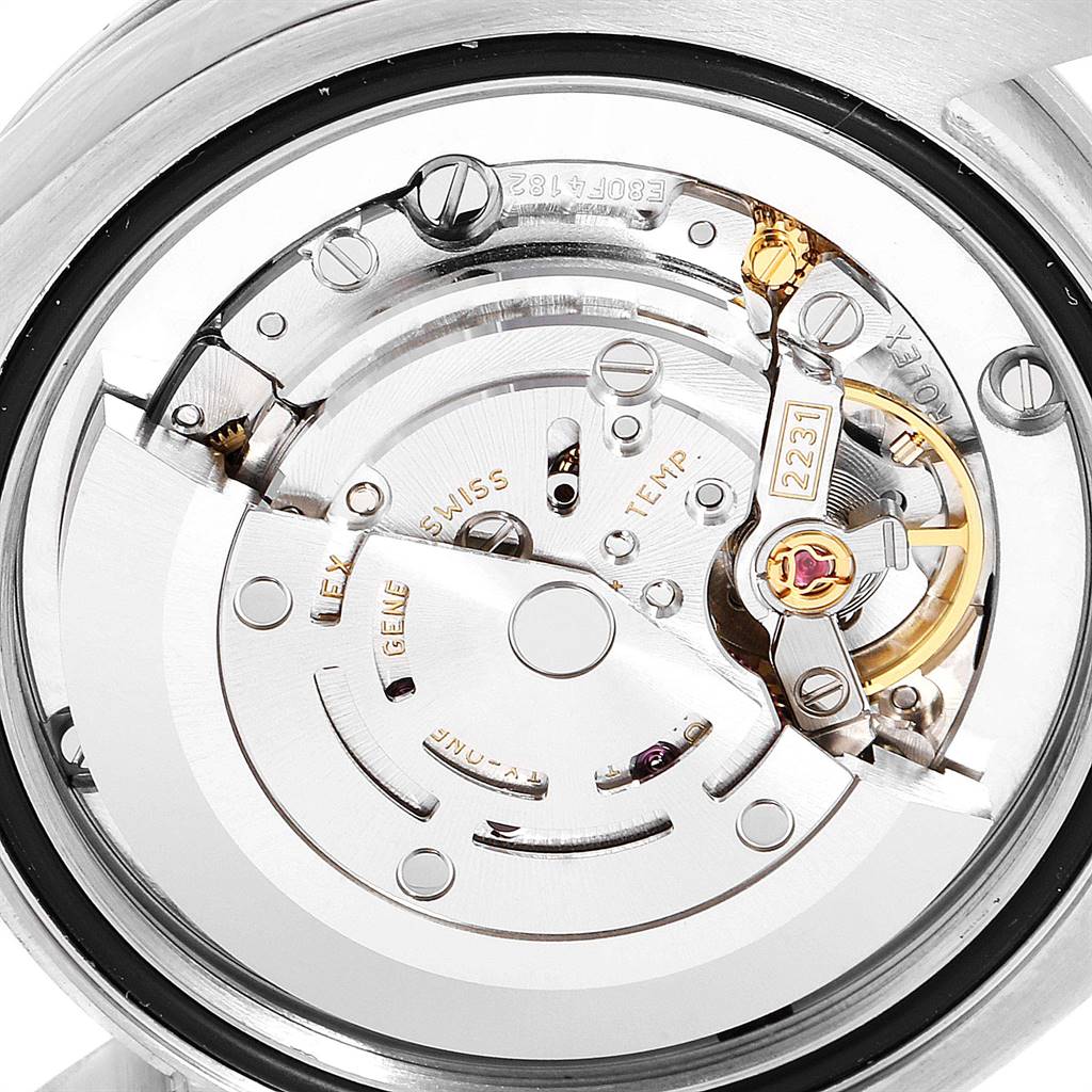The image shows a close-up of the Rolex Mid-Size 177200 Women's Stainless Steel White Dial 177200 Women's Stainless Steel White Dial watch's movement and inner mechanical parts from the back.