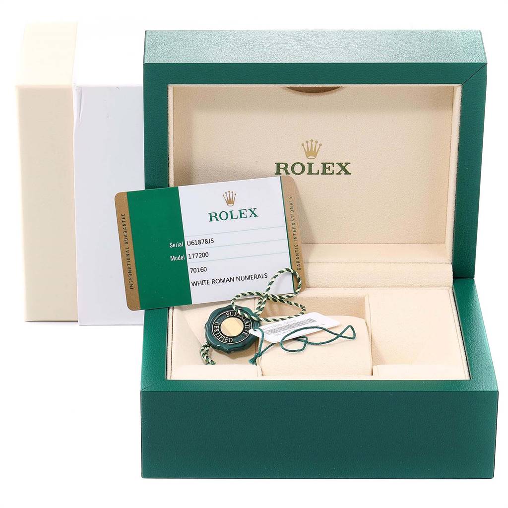 This is an open Rolex box showing warranty cards and tags for the Mid-Size model 177200.
