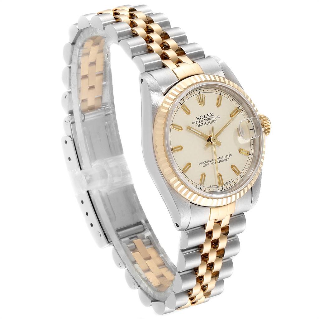 The image shows a side angle of a Rolex Mid-Size 68273 Women's Steel and Gold (two tone) Beige Dial 68273 Women's Steel and Gold (two tone) Beige Dial Datejust watch featuring a two-tone bracelet and a champagne dial.