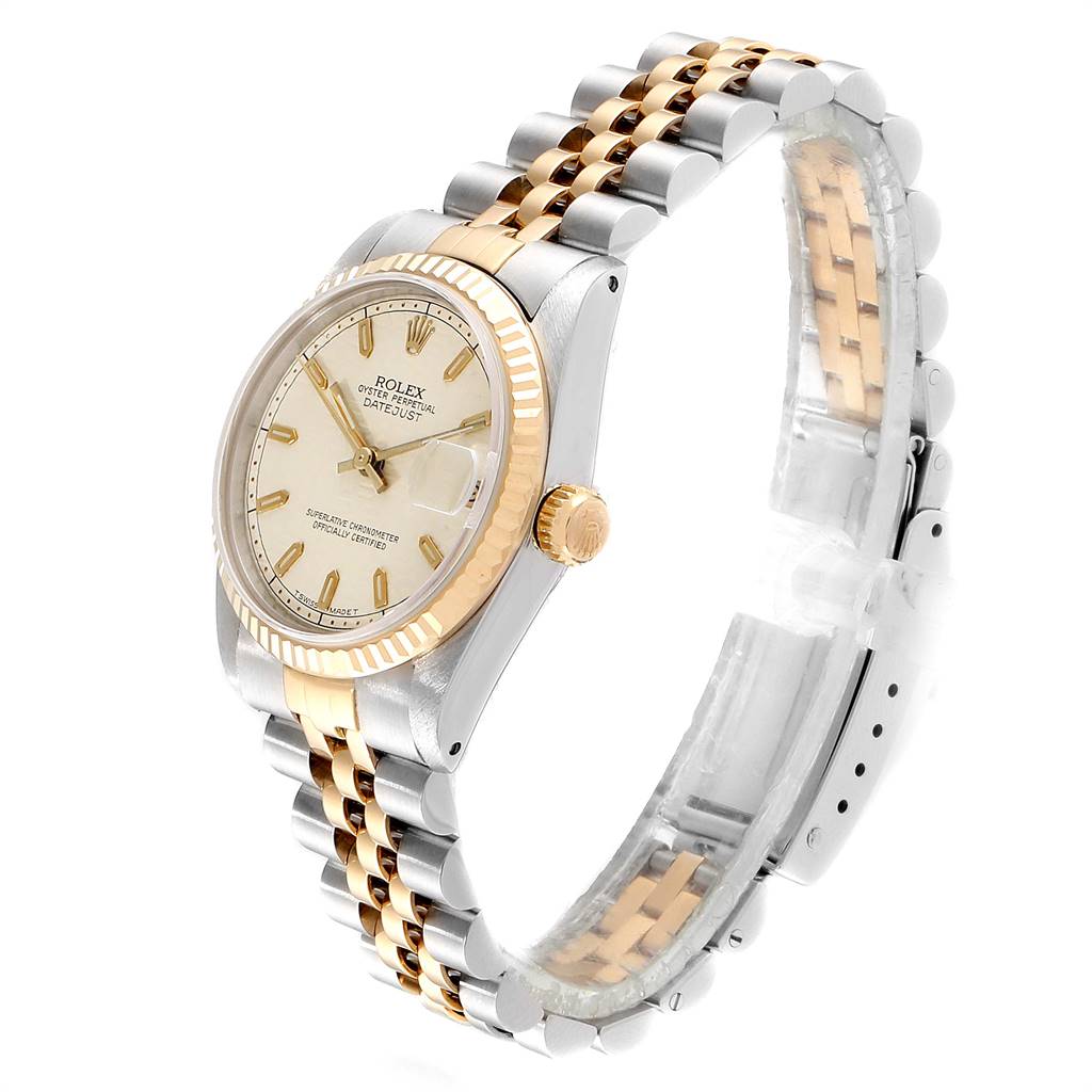 This image shows a Rolex Mid-Size 68273 Women's Steel and Gold (two tone) Beige Dial 68273 Women's Steel and Gold (two tone) Beige Dial Datejust watch at a three-quarter angle, highlighting its dial, bezel, crown, and bracelet.