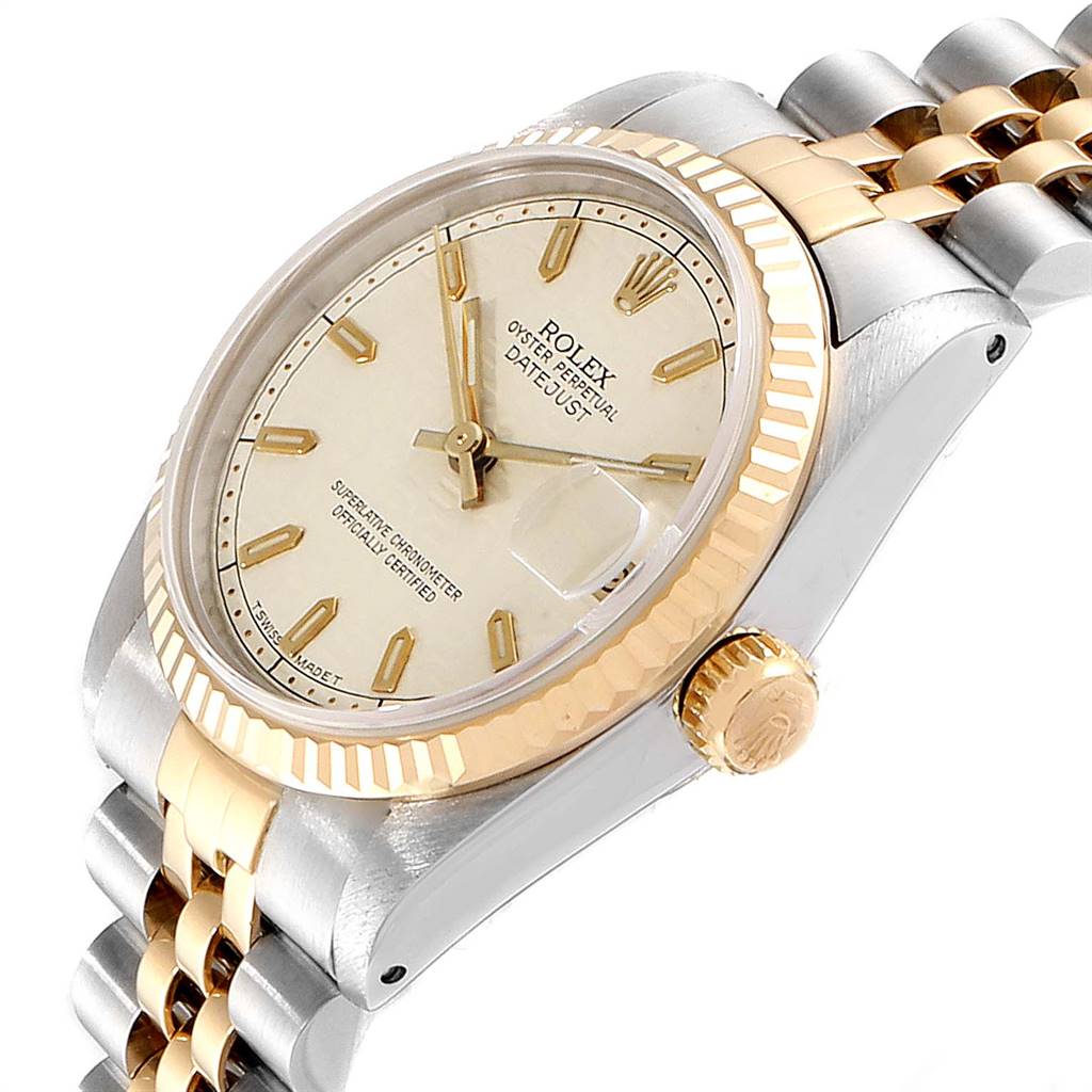 The image shows a Rolex Mid-Size 68273 Women's Steel and Gold (two tone) Beige Dial 68273 Women's Steel and Gold (two tone) Beige Dial Oyster Perpetual Datejust watch angled to display its dial, bezel, and partial bracelet.