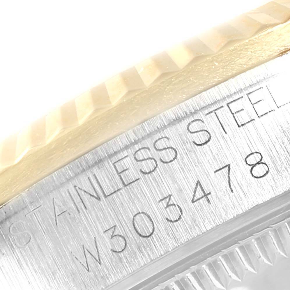 This close-up image shows the stainless steel case side and part of the fluted bezel of a Rolex Mid-Size 68273 Women's Steel and Gold (two tone) Champagne Dial 68273 Women's Steel and Gold (two tone) Champagne Dial model watch.