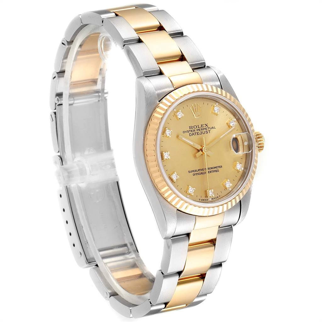The image shows a Rolex Mid-Size 68273 Women's Steel and Gold (two tone) Champagne Dial 68273 Women's Steel and Gold (two tone) Champagne Dial Datejust watch at an angle, highlighting its two-tone bracelet, champagne dial, and fluted bezel.