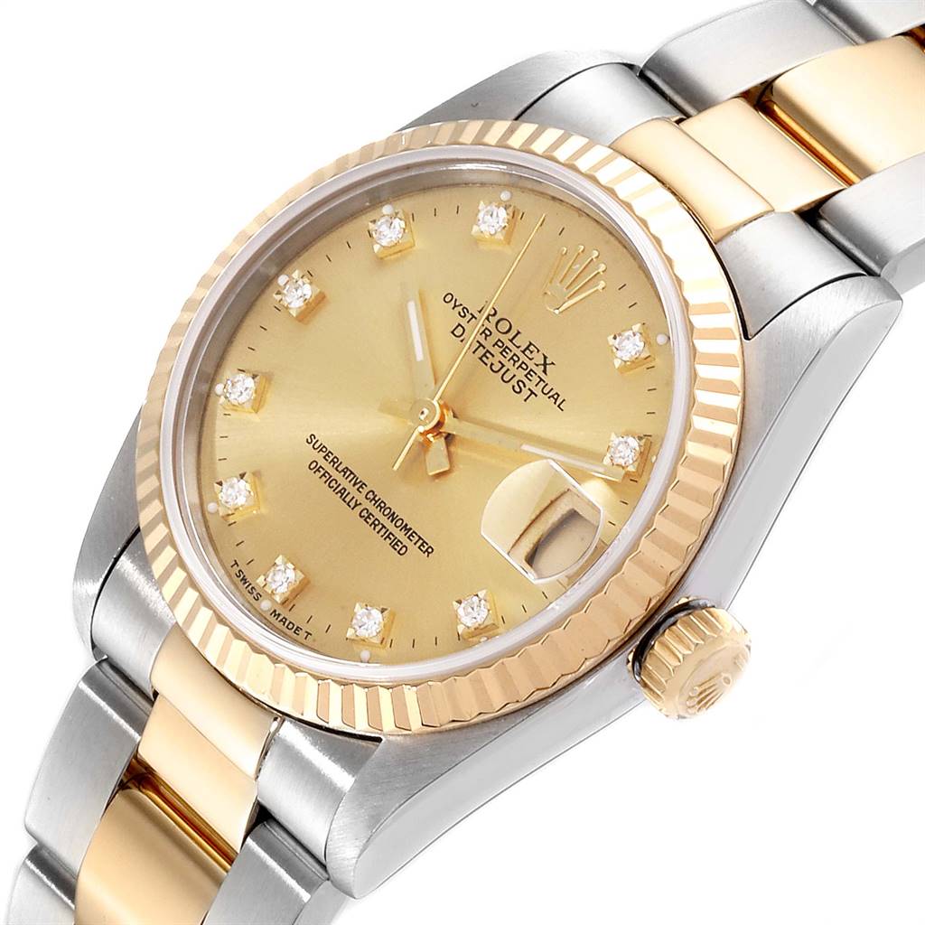 This image shows a Rolex Mid-Size 68273 Women's Steel and Gold (two tone) Champagne Dial 68273 Women's Steel and Gold (two tone) Champagne Dial watch at a three-quarter angle, highlighting its gold dial, fluted bezel, and two-tone bracelet.