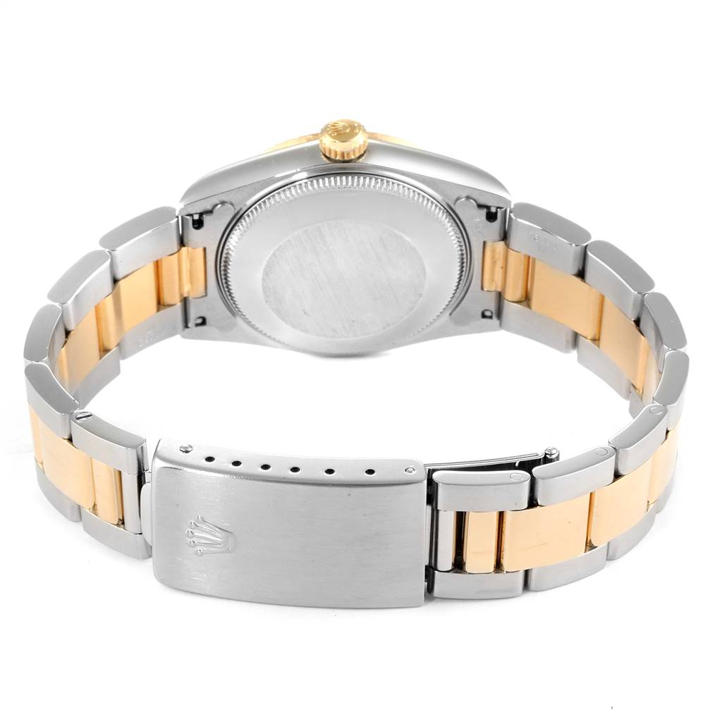 This image shows the back case and band of the Rolex Mid-Size 68273 Women's Steel and Gold (two tone) Champagne Dial 68273 Women's Steel and Gold (two tone) Champagne Dial watch, highlighting its two-tone design.