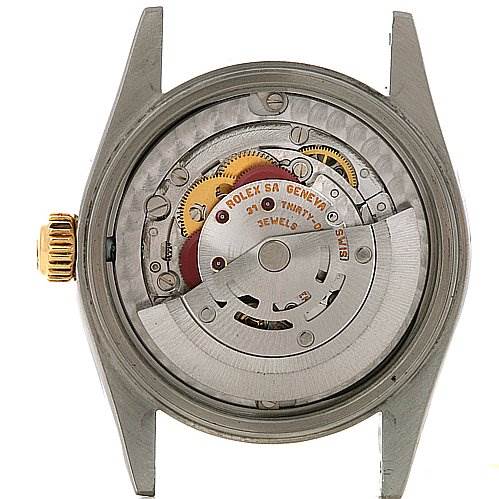 This image shows the movement and internal mechanics of a Rolex Mid-Size 78273 Women's Stainless Steel Beige Dial 78273 Women's Stainless Steel Beige Dial watch from the back.