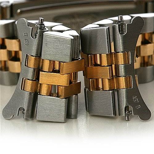 The image shows a close-up of the bracelet links for a Mid-Size Rolex watch, highlighting the two-tone metal components.