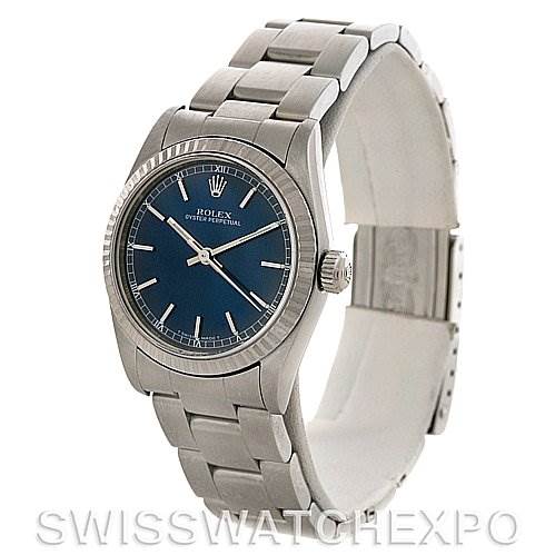 The Rolex Mid-Size 77014 Women's Stainless Steel Blue Dial 77014 Women's Stainless Steel Blue Dial watch is shown at a three-quarter angle, displaying the face, bezel, bracelet, and crown.