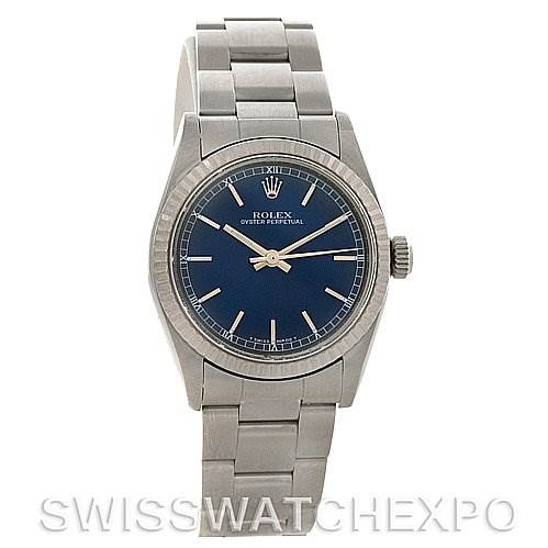 The image shows a front view of a Rolex Mid-Size 77014 Women's Stainless Steel Blue Dial 77014 Women's Stainless Steel Blue Dial Oyster Perpetual watch with a blue dial and stainless steel bracelet.