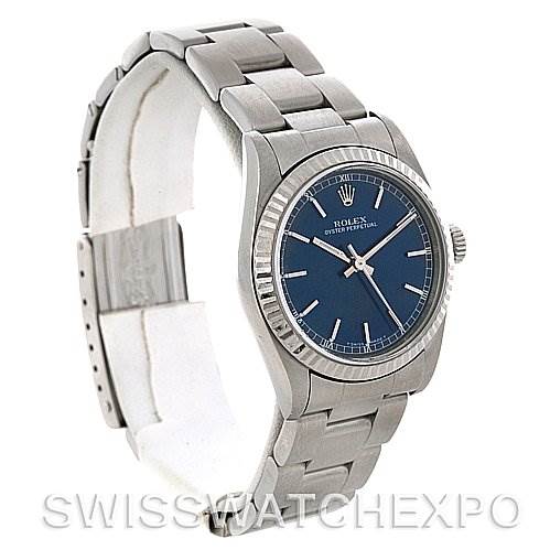 The image shows a Rolex Mid-Size 77014 Women's Stainless Steel Blue Dial 77014 Women's Stainless Steel Blue Dial model watch at a slight angle, highlighting the blue dial, bezel, crown, and stainless steel bracelet.