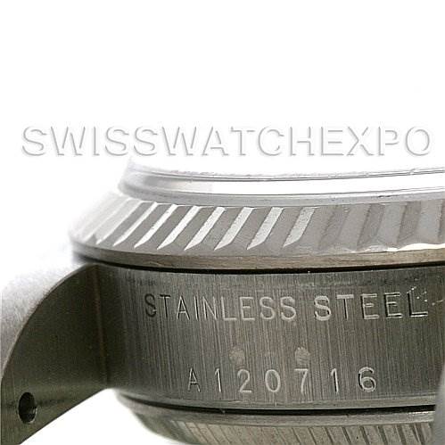 The image shows a close-up angle of the side and bezel of a mid-size Rolex watch, highlighting the stainless steel finish and serial number "A120716."