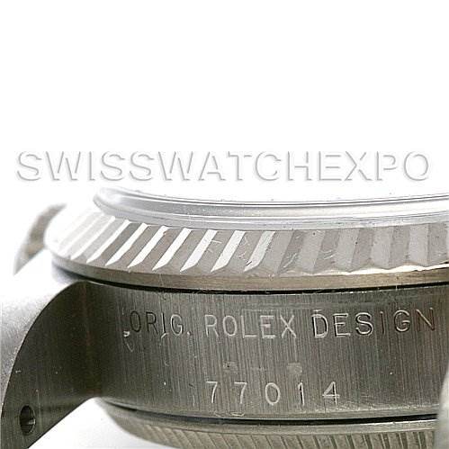 This image shows a side view of the case and bezel of a Rolex Mid-Size 77014 Women's Stainless Steel Blue Dial 77014 Women's Stainless Steel Blue Dial watch, featuring the "ORIG. ROLEX DESIGN" engraving and model number 77014.