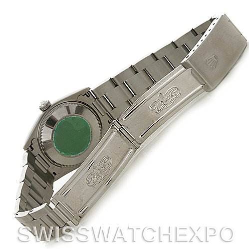 This image shows the backside of a Rolex Mid-Size 77014 Women's Stainless Steel Blue Dial 77014 Women's Stainless Steel Blue Dial watch, highlighting the case back and bracelet clasp.