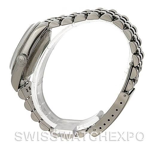This image shows the side profile of a Rolex Mid-Size 78240 Women's Stainless Steel White Dial 78240 Women's Stainless Steel White Dial model watch, showcasing its crown and metal bracelet.
