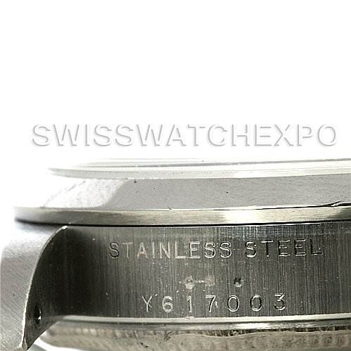 This image shows the side of a Rolex Mid-Size 78240 Women's Stainless Steel White Dial 78240 Women's Stainless Steel White Dial model watch case with the "STAINLESS STEEL" engraving and serial number.