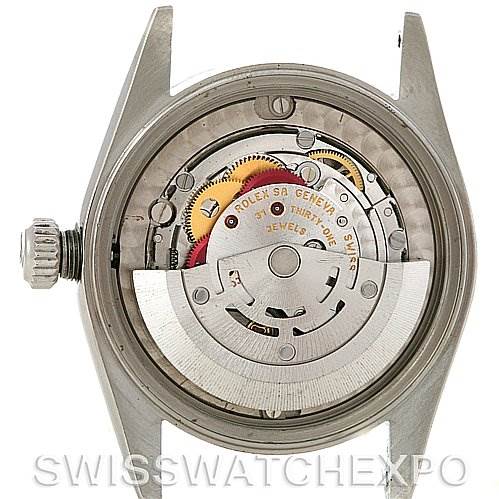 The image shows the movement and interior components of a Rolex Mid-Size 78240 Women's Stainless Steel White Dial 78240 Women's Stainless Steel White Dial watch from a back view, including gears and the rotor.