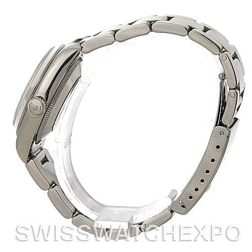 The image shows a side profile view of a Rolex Mid-Size 68240 Women's Stainless Steel Pink Dial 68240 Women's Stainless Steel Pink Dial model, highlighting the watch case, crown, and metal bracelet.