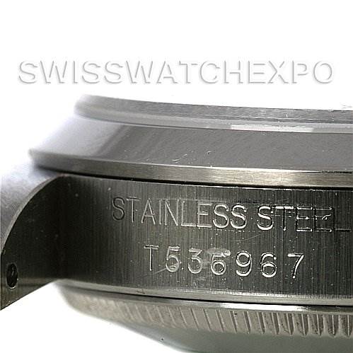 This image shows a side view of the casing of a Rolex Mid-Size 68240 Women's Stainless Steel Pink Dial 68240 Women's Stainless Steel Pink Dial model, focusing on the stainless steel engraving and serial number.