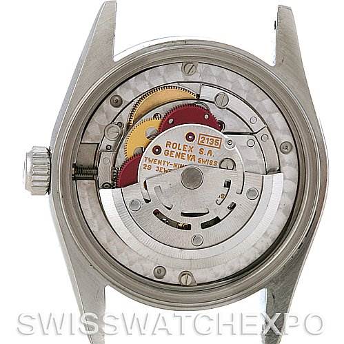 This image shows the back view of a Rolex Mid-Size 68240 Women's Stainless Steel Pink Dial 68240 Women's Stainless Steel Pink Dial model watch revealing its internal movement.