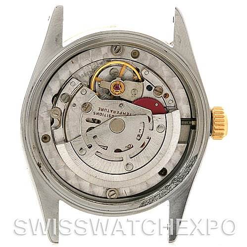 This image shows the inner mechanism of a mid-size Rolex watch from a back angle, highlighting the movement
s intricate details.