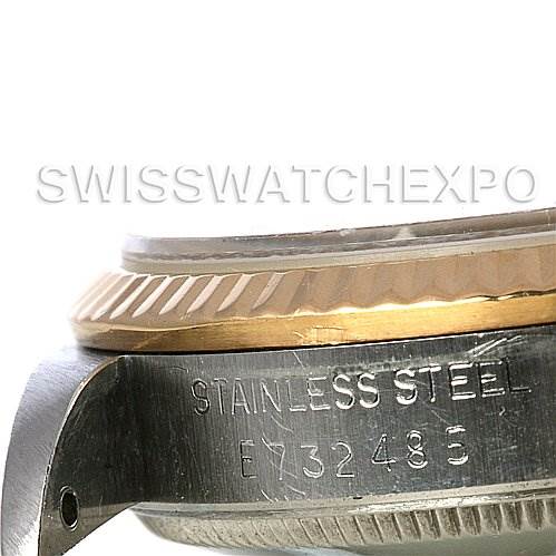 The image shows a close-up side view of the case and bezel of a Mid-Size Rolex watch, with visible stainless steel markings.