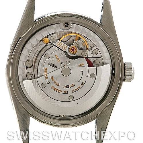 This image shows the internal mechanical movement of a Mid-Size Rolex watch from a rear angle with the case back removed.