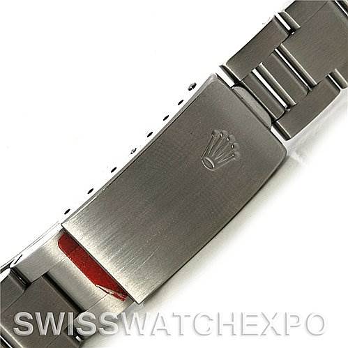 This image shows the clasp and part of the bracelet of a Mid-Size Rolex watch, detailing the engraved Rolex crown logo.