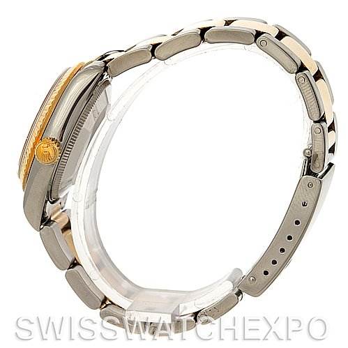 This is a side view of the Rolex Mid-Size 68273 Women's Stainless Steel White Dial 68273 Women's Stainless Steel White Dial model showing the watch case, crown, and stainless steel bracelet.