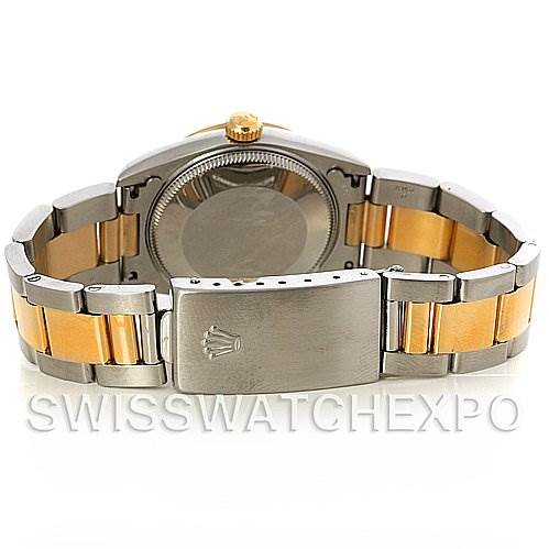 The image shows the back case and bracelet of a Mid-Size Rolex model, featuring a stainless steel and gold band with the clasp open.