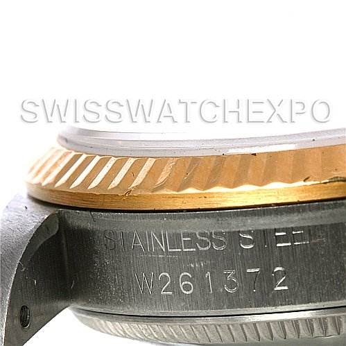 This image shows a close-up side view of the bezel and part of the case of a Rolex Mid-Size 68273 Women's Stainless Steel White Dial 68273 Women's Stainless Steel White Dial watch, highlighting the engraved serial number.