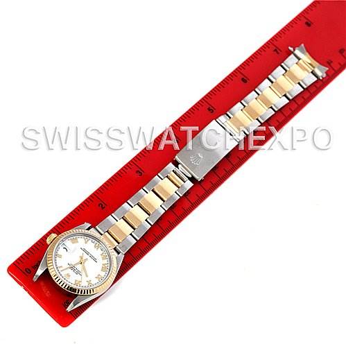 The image shows a Rolex Mid-Size 68273 Women's Stainless Steel White Dial 68273 Women's Stainless Steel White Dial watch, viewed from above, displaying the full bracelet and dial on a red measuring ruler.