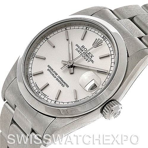 The image shows a Rolex Mid-Size 68240 Women's Stainless Steel Silver Dial 68240 Women's Stainless Steel Silver Dial Datejust watch at an angled view, highlighting the dial, bezel, crown, and a portion of the bracelet.