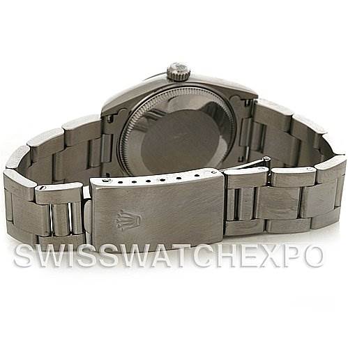 The image shows the back of a Mid-Size Rolex watch, highlighting the bracelet and clasp with the Rolex logo.