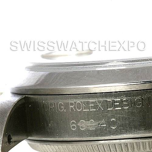 This close-up image of a Rolex Mid-Size 68240 Women's Stainless Steel Silver Dial 68240 Women's Stainless Steel Silver Dial model watch showcases the side of the watch case and the engraved design details.