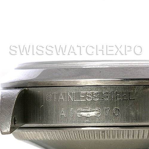 This image shows a close-up view of the side of a stainless steel Rolex Mid-Size 68240 Women's Stainless Steel Silver Dial 68240 Women's Stainless Steel Silver Dial model watch case, displaying engravings and part of the bezel.